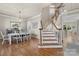 Elegant dining room with hardwood floors, stylish chandelier, and adjacent staircase at 17327 Summers Walk Blvd, Davidson, NC 28036