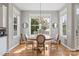 Cozy dining room with hardwood floors, large windows, and elegant chandelier at 17327 Summers Walk Blvd, Davidson, NC 28036