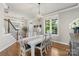 Charming dining room featuring hardwood floors and a modern chandelier at 17327 Summers Walk Blvd, Davidson, NC 28036