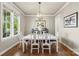 Charming dining room featuring hardwood floors and a modern chandelier at 17327 Summers Walk Blvd, Davidson, NC 28036