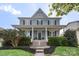 Charming two-story home featuring a welcoming front porch and manicured landscaping at 17327 Summers Walk Blvd, Davidson, NC 28036