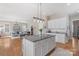 Bright, open kitchen featuring a large center island with granite countertops and stainless steel appliances at 17327 Summers Walk Blvd, Davidson, NC 28036