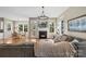 Bright, open living room features a fireplace, hardwood floors, and comfortable, stylish furnishings at 17327 Summers Walk Blvd, Davidson, NC 28036