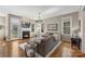 Inviting living room with cozy fireplace, hardwood floors, and stylish sectional sofa at 17327 Summers Walk Blvd, Davidson, NC 28036