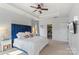 Serene main bedroom featuring a tray ceiling, soft carpet, and access to a closet at 17327 Summers Walk Blvd, Davidson, NC 28036
