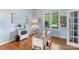 Bright home office with hardwood floors, a large window, and a modern desk at 17327 Summers Walk Blvd, Davidson, NC 28036