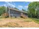 Single-story home showcasing a backyard with dual decks, blending indoor and outdoor living at 1870 Hwy 49 None, New London, NC 28127