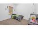 Well-lit bedroom with a window, neutral carpet, and an interesting fish tank at 1870 Hwy 49 None, New London, NC 28127