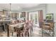 Bright dining room features a stylish table, with an adjacent kitchen area for seamless entertaining at 1870 Hwy 49 None, New London, NC 28127