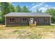 Charming single-story home with gray siding, red shutters, and a cozy front porch at 1870 Hwy 49 None, New London, NC 28127