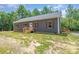 Inviting single-story home featuring a side entrance and new construction, nestled in a wooded landscape at 1870 Hwy 49 None, New London, NC 28127