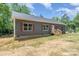 Single-story home featuring a inviting front entrance and new construction, nestled in a wooded landscape at 1870 Hwy 49 None, New London, NC 28127