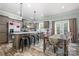 Open-concept kitchen and dining area with stainless steel appliances and backyard access at 1870 Hwy 49 None, New London, NC 28127