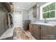 Functional laundry room with washer, dryer, utility sink, and ample storage at 1870 Hwy 49 None, New London, NC 28127