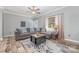 Comfortable living room featuring a sectional sofa, stylish rug, ceiling fan and natural light at 1870 Hwy 49 None, New London, NC 28127