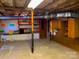 Unfinished basement space with exposed ceiling and wood cabinetry at 209 8Th Nw Ave, Hickory, NC 28601
