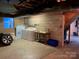 Unfinished basement featuring washer and dryer hookups, and utility sink at 209 8Th Nw Ave, Hickory, NC 28601
