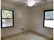 This bedroom has two windows and a ceiling fan at 209 8Th Nw Ave, Hickory, NC 28601