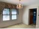 Bright dining area featuring a chandelier and a large window at 209 8Th Nw Ave, Hickory, NC 28601