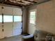 Attached garage with single door, interior entry door, and couch at 209 8Th Nw Ave, Hickory, NC 28601