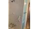 Bathroom shower featuring tiled walls and safety hand rail at 209 8Th Nw Ave, Hickory, NC 28601