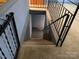 A carpeted stairway leads to the basement at 209 8Th Nw Ave, Hickory, NC 28601
