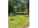 A spacious backyard surrounded by lush, mature trees at 2120 Marwood Ln, Albemarle, NC 28001