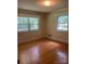 Bright bedroom with gleaming hardwood floors and two windows allowing for lots of natural light at 2120 Marwood Ln, Albemarle, NC 28001
