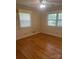 Bedroom features hardwood floors, neutral walls and sunny windows at 2120 Marwood Ln, Albemarle, NC 28001