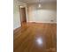 Bright bedroom with hardwood floors and neutral walls, offering a versatile space for personalization at 2120 Marwood Ln, Albemarle, NC 28001