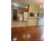 Open concept kitchen and dining area with wood cabinets and white appliances, ideal for casual dining and entertaining at 2120 Marwood Ln, Albemarle, NC 28001