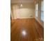 Bright living room boasts hardwood floors, neutral walls, and natural light from large windows at 2120 Marwood Ln, Albemarle, NC 28001