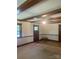 Spacious living room features wooden ceiling beams, carpet, and lots of natural light at 2120 Marwood Ln, Albemarle, NC 28001