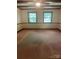 Spacious carpeted living room features wooden ceiling beams and plenty of natural light at 2120 Marwood Ln, Albemarle, NC 28001
