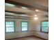 Bright living room features beautiful wooden ceiling beams and plenty of natural light at 2120 Marwood Ln, Albemarle, NC 28001