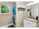 Bright bathroom with a window, vanity, and shower at 21322 Mccall St, Cornelius, NC 28031