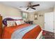 Bedroom with a ceiling fan, window, and hardwood floors at 21322 Mccall St, Cornelius, NC 28031