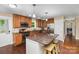 The kitchen features stainless appliances, granite countertops and hardwood floors at 21322 Mccall St, Cornelius, NC 28031