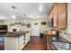 Kitchen with island, stainless appliances, and hardwood floors at 21322 Mccall St, Cornelius, NC 28031