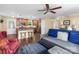 Open-concept living area with a kitchen island and hardwood floors at 21322 Mccall St, Cornelius, NC 28031