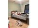 A bedroom with a bed frame, window with curtains, and carpeted floor at 227 James Rd, Taylorsville, NC 28681