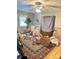 Spacious bedroom with hardwood floors, ceiling fan, and large windows providing natural light at 227 James Rd, Taylorsville, NC 28681