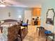 Cozy living room featuring tiled flooring, a ceiling fan, and a doorway to the kitchen at 227 James Rd, Taylorsville, NC 28681