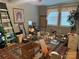 Room featuring large windows, area rug, lighting, and storage at 227 James Rd, Taylorsville, NC 28681