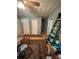 Room with wood floors, interior doors, area rug, and ladder at 227 James Rd, Taylorsville, NC 28681