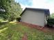 Side view of the home showing the siding, trim, and landscaped yard at 227 James Rd, Taylorsville, NC 28681