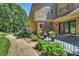 Charming outdoor patio area with elegant wrought iron railing and lush landscaping at 2317 Houston Branch Rd, Charlotte, NC 28270