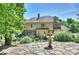 Beautiful backyard with a stone patio, water feature, and manicured landscaping perfect for entertaining at 2317 Houston Branch Rd, Charlotte, NC 28270