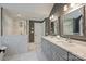 Elegant bathroom features a double vanity, marble countertop, and a glass-enclosed shower at 2317 Houston Branch Rd, Charlotte, NC 28270