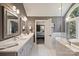 Beautiful bathroom with double vanity, large mirror, soaking tub, and bright natural light at 2317 Houston Branch Rd, Charlotte, NC 28270